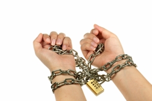 Image of a woman's hands in chains